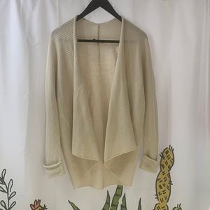 This is a lovely cream colored cardigan! Perfect for up dressing or casual